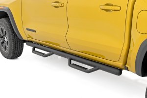 GMC Canyon Nerf Steps - Cab Length - Rough Country - Enhanced Undercarriage Protection with Integrated Stone Guards - '15-'25